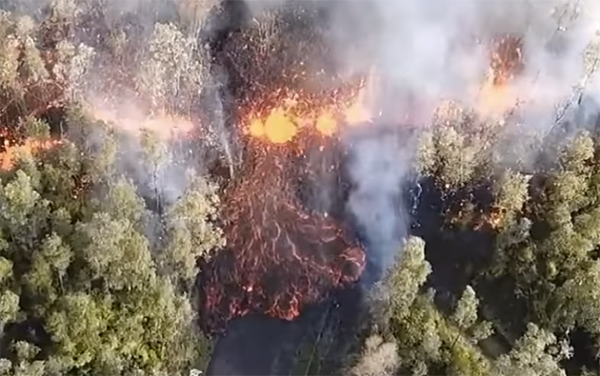 Volcano, lava spreads across road, Hawaii, May 2018.